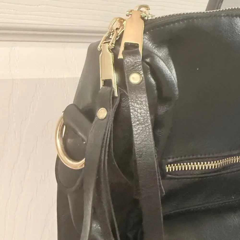 Black Leather Modern + Chic Bag backpack EUC. Lined w/purple. Looks New!